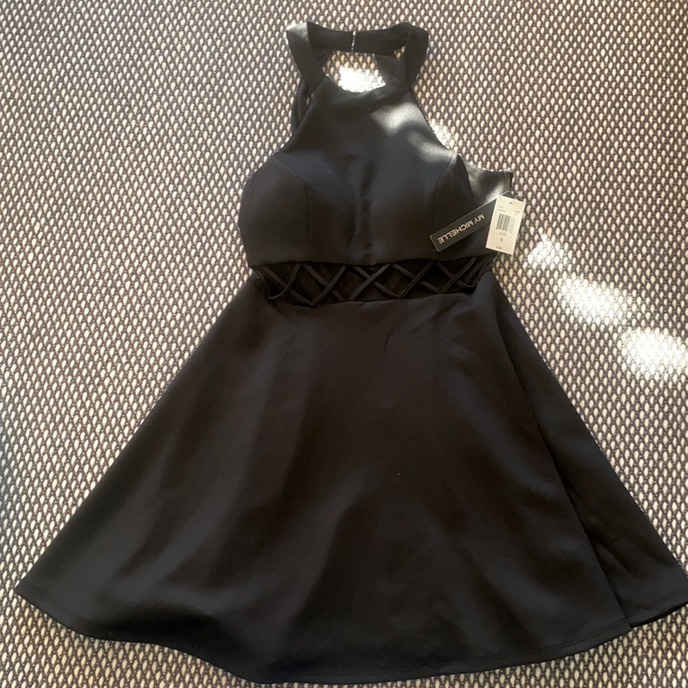 Stylish high-neck black dress with sheer waist